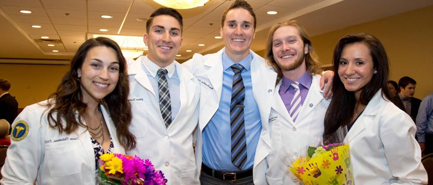 Physician Assistant degree program students at white coat ceremony.